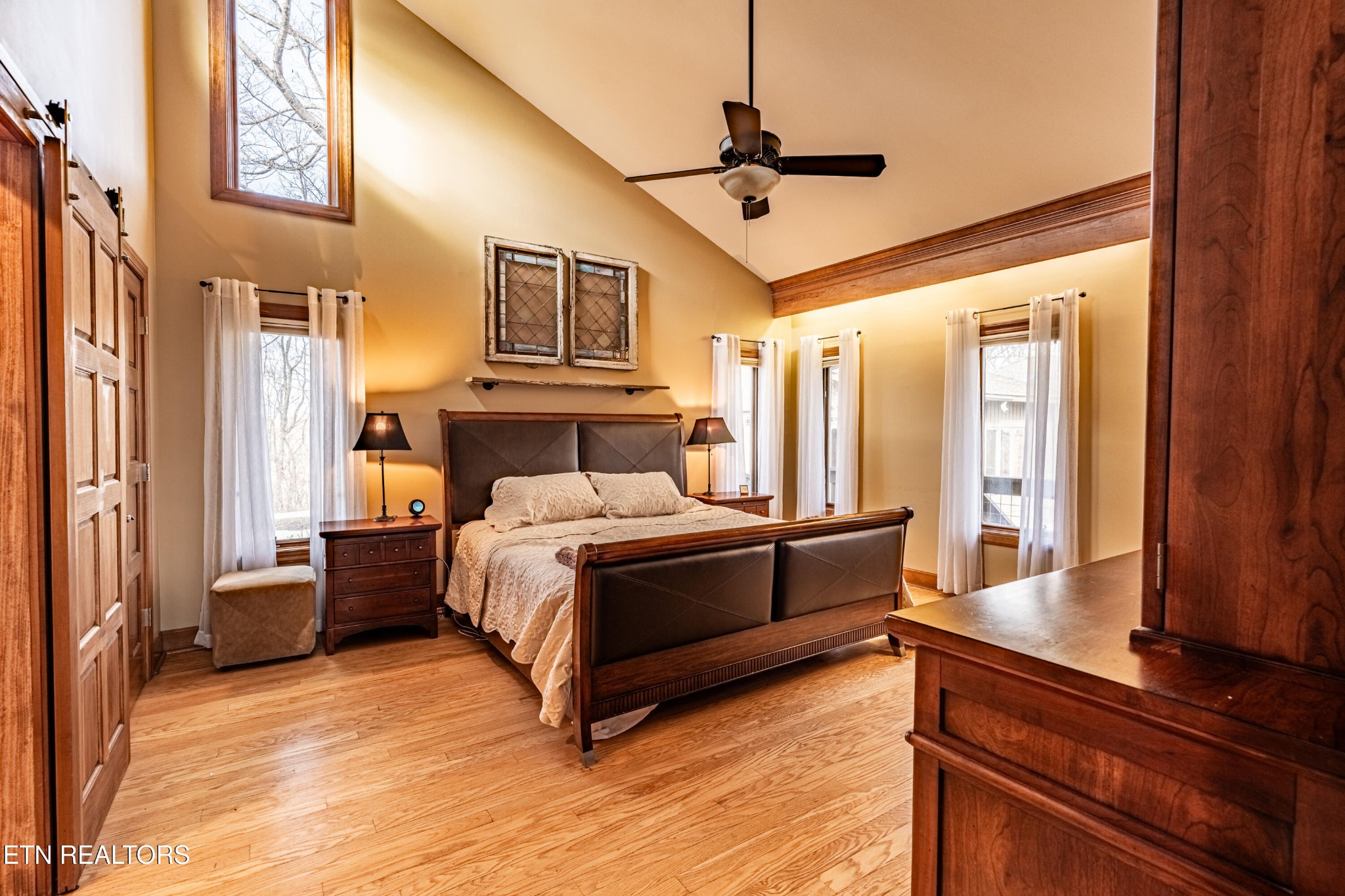 11104 Poplar Ridge Road Knoxville, TN 37932 - Photo 4 of 53 a bedroom with a bed and wooden floor