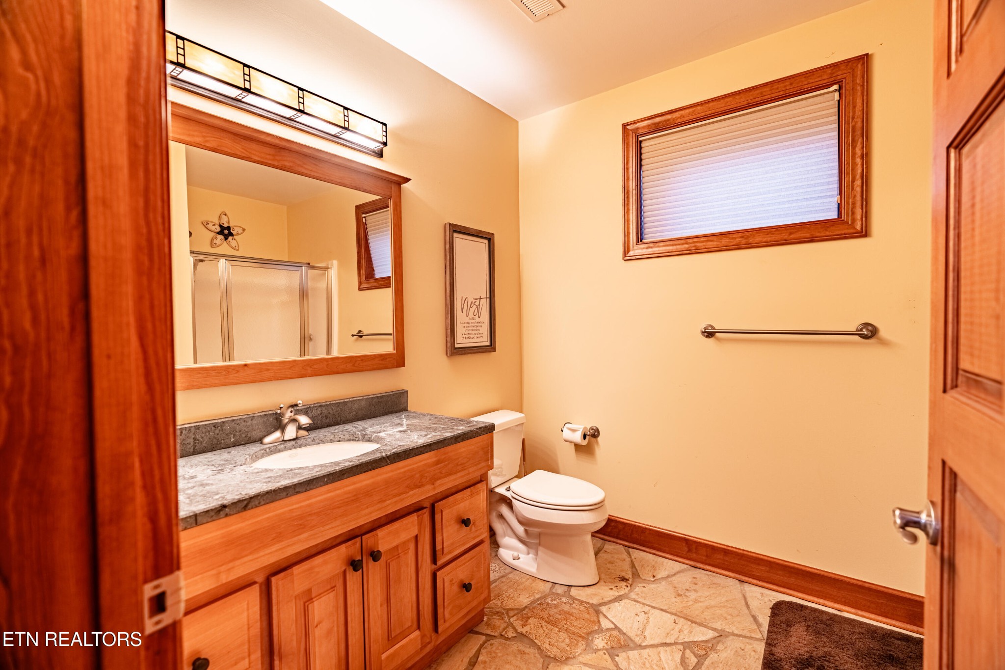 11104 Poplar Ridge Road Knoxville, TN 37932 - Photo 43 of 53 a bathroom with a granite countertop sink toilet and shower