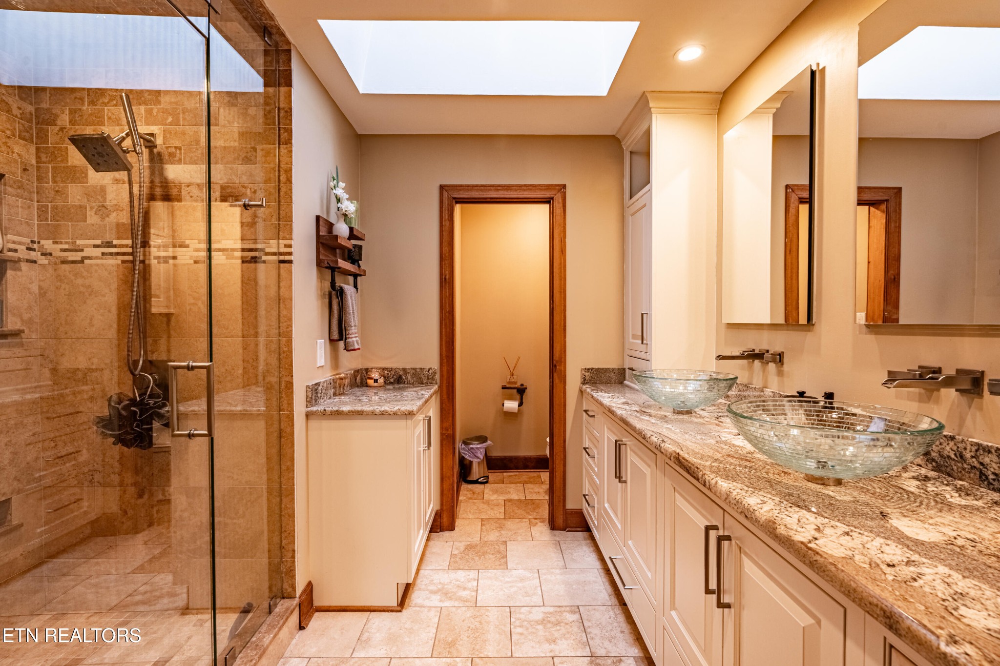 11104 Poplar Ridge Road Knoxville, TN 37932 - Photo 5 of 53 a bathroom with a granite countertop sink a mirror and a shower