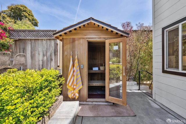 a view of kitchen with granite countertop and wooden floor