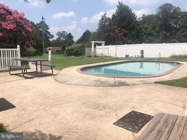 7914 Elizabeth Road Pasadena, MD 21122 - Photo 9 of 29 PATIO AREA OFF OF THE POOL