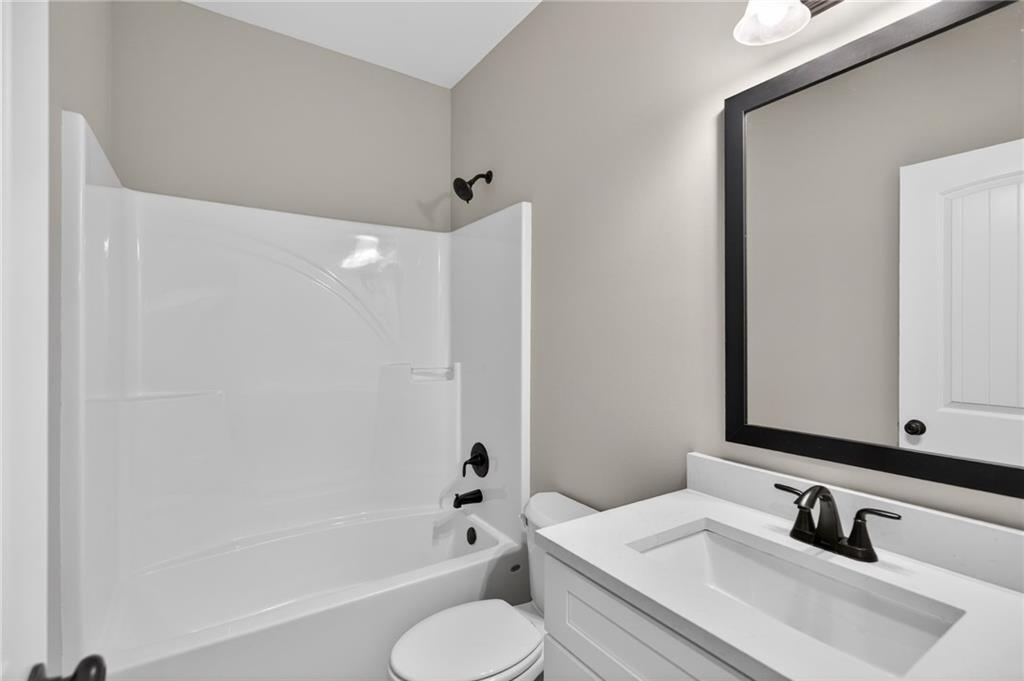 423 Relay Road Silver Creek, GA 30173 - Photo 33 of 48 a bathroom with a sink toilet and shower