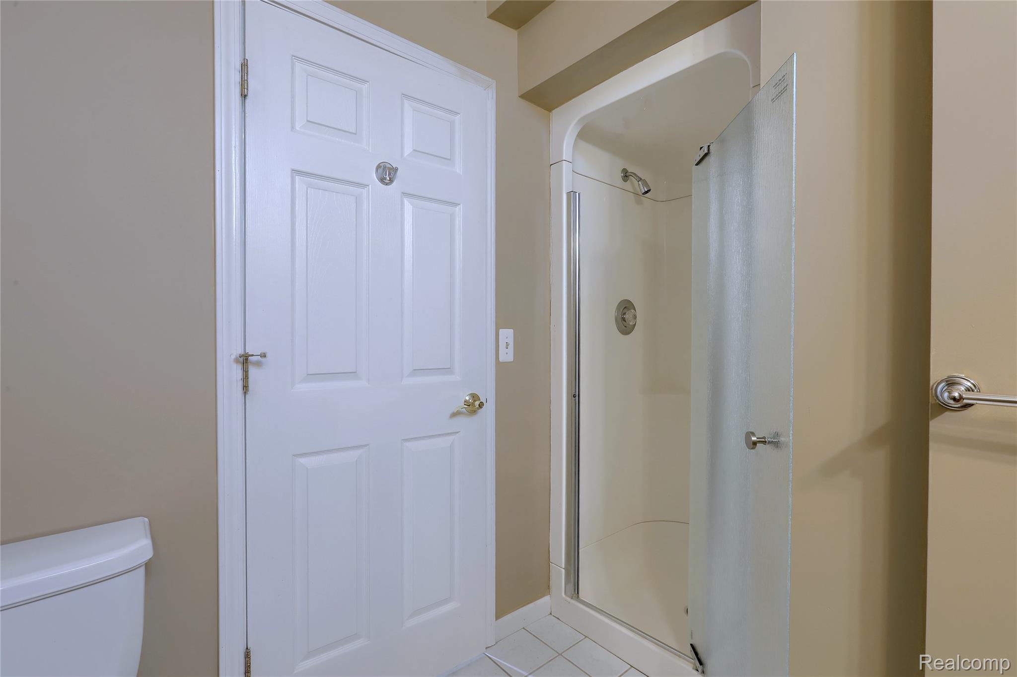 2007 Mapleridge Road Rochester, MI 48309 - Photo 35 of 45 Bathroom with a shower stall and light tile patterned flooring