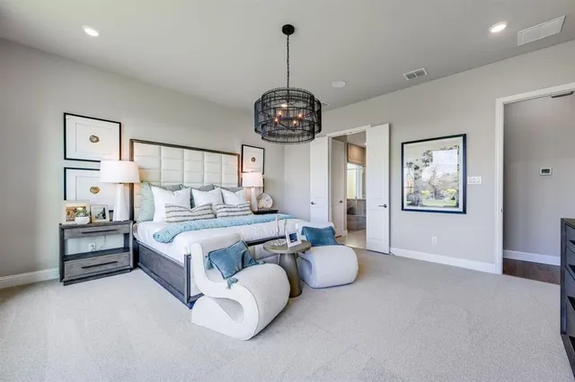 a view of a workspace with furniture and a bookshelf