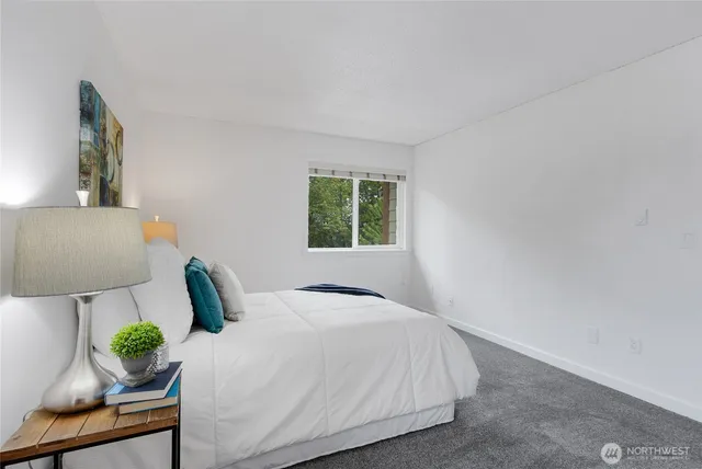 a bedroom with a bed and window