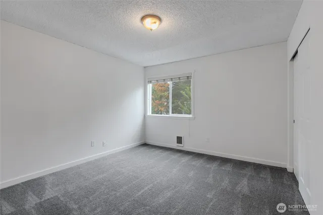 a bathroom with a toilet a sink and a mirror