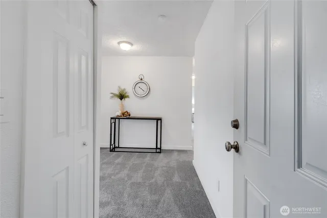 a view of a room with wooden door