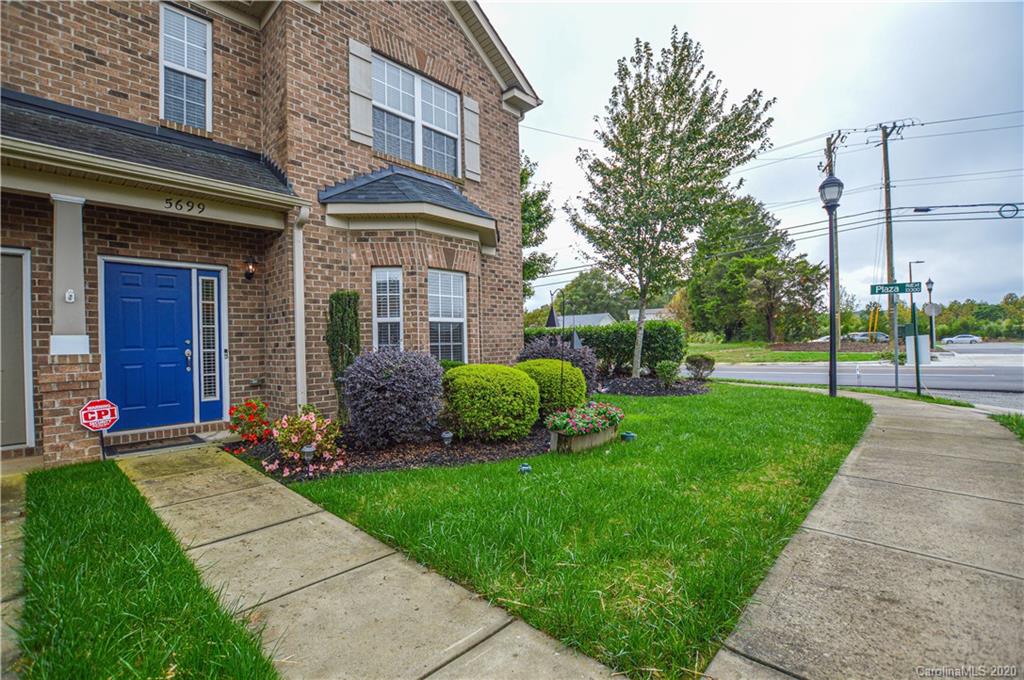 5699 Stafford Road Charlotte, NC 28215 - Photo 1 of 23 a view of a brick house next to a yard