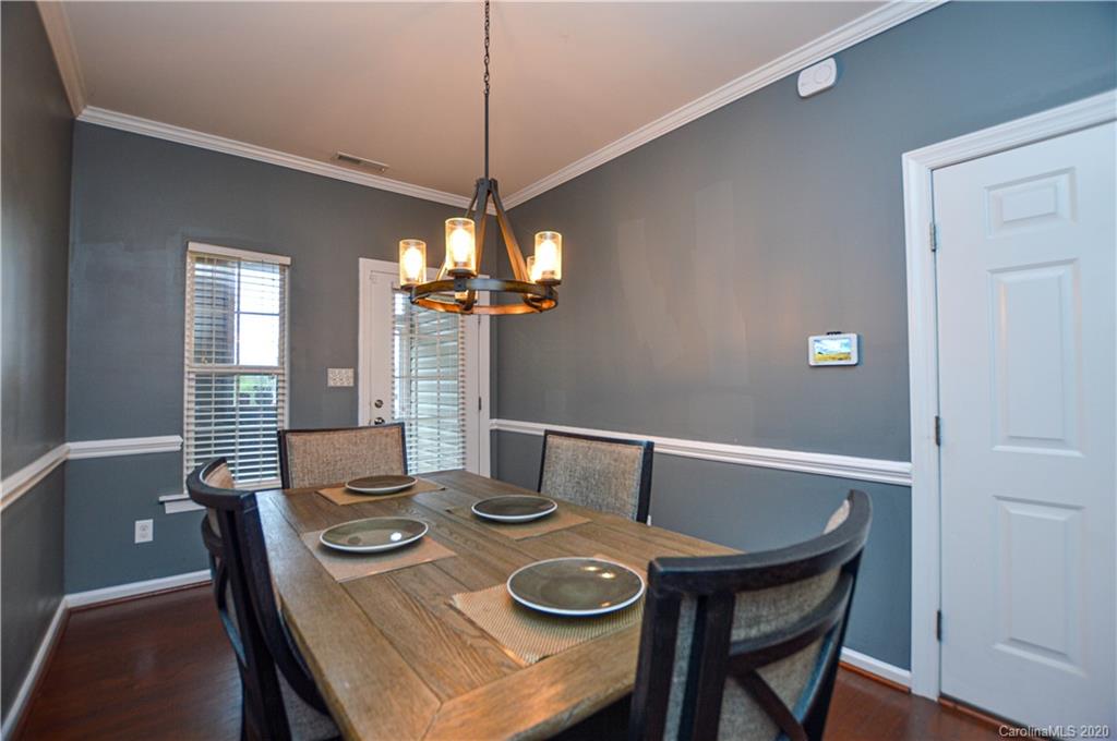 5699 Stafford Road Charlotte, NC 28215 - Photo 11 of 23 a view of a dining room with a table and chairs