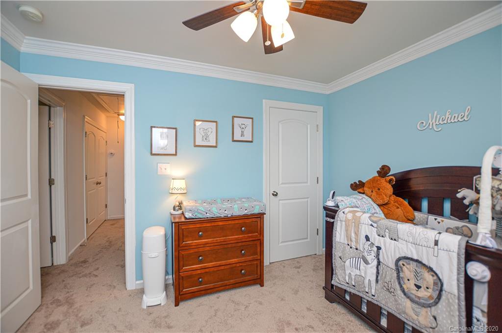 5699 Stafford Road Charlotte, NC 28215 - Photo 13 of 23 a room with a refrigerator and a stove