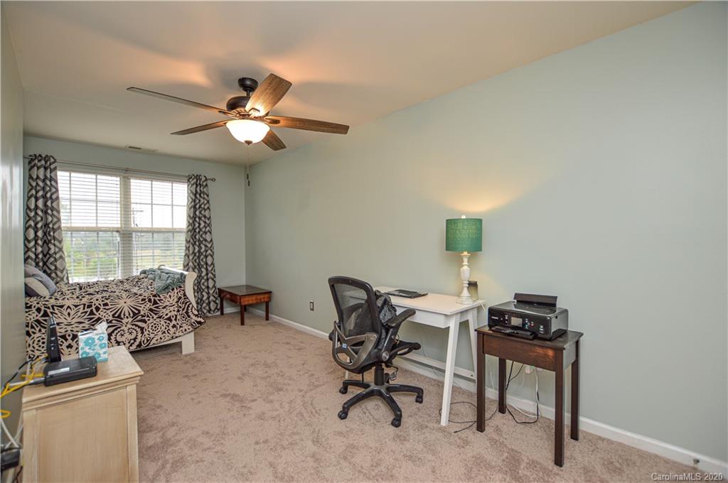 5699 Stafford Road Charlotte, NC 28215 - Photo 15 of 23 a workspace with furniture and a window