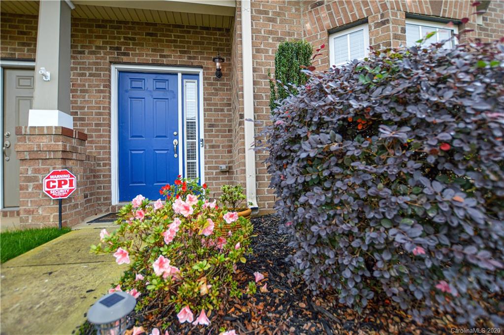 5699 Stafford Road Charlotte, NC 28215 - Photo 3 of 23 a sign that is in front of flowers