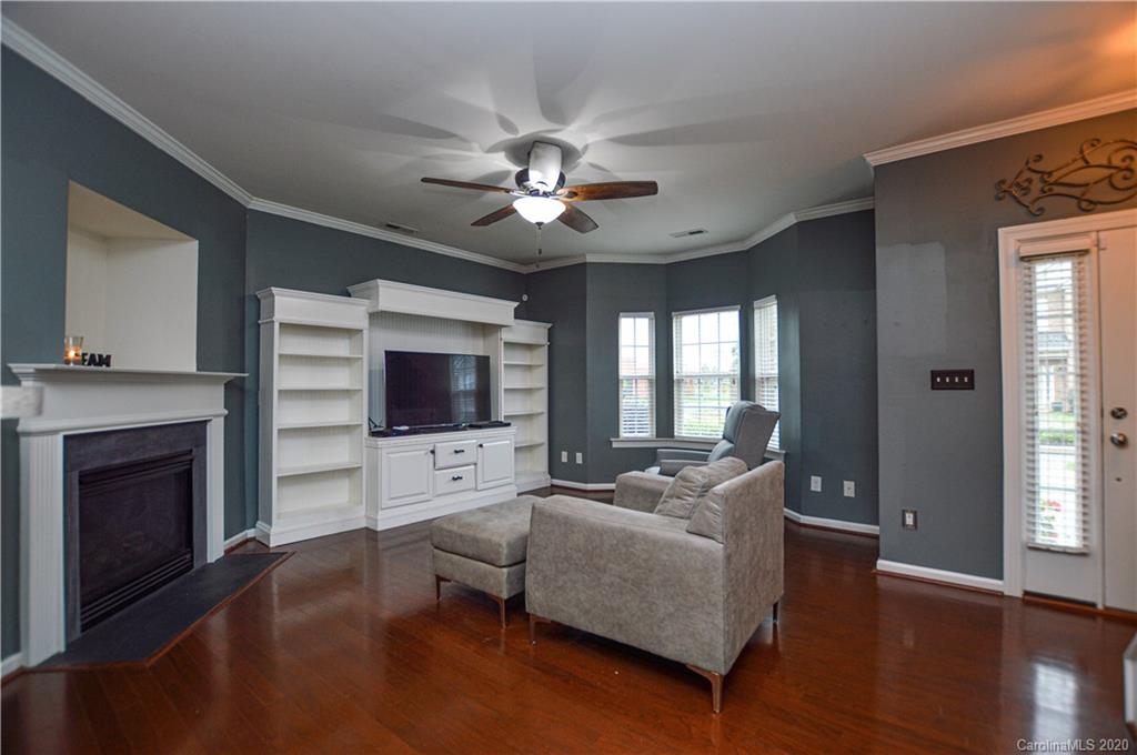 5699 Stafford Road Charlotte, NC 28215 - Photo 4 of 23 a living room with furniture fireplace and a flat screen tv