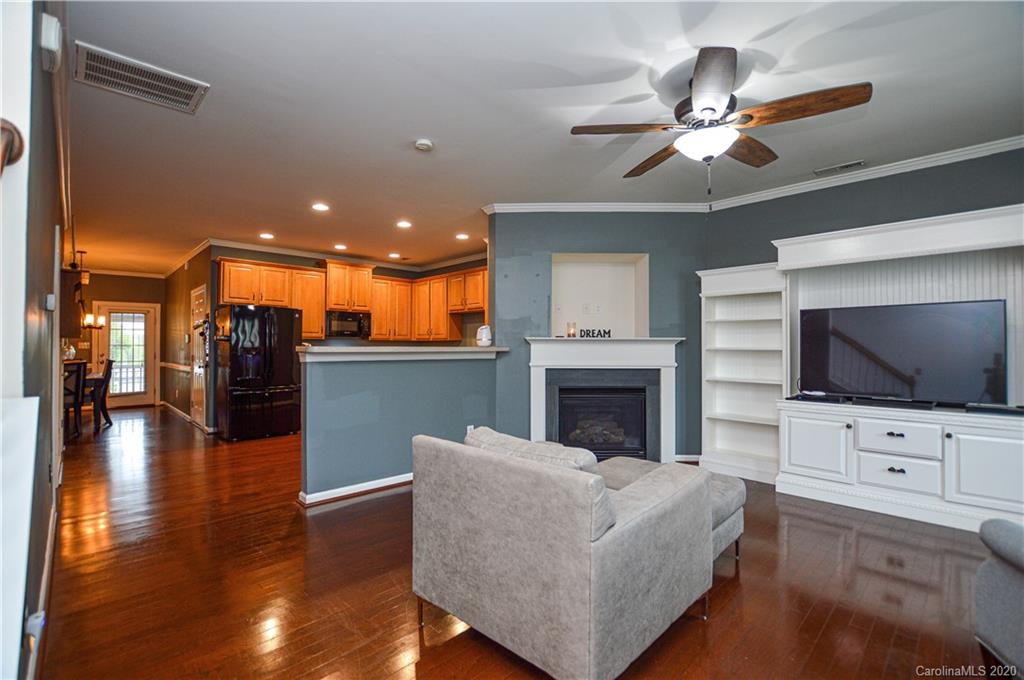 5699 Stafford Road Charlotte, NC 28215 - Photo 5 of 23 a living room with furniture and a flat screen tv