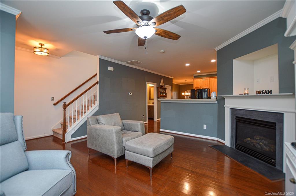 5699 Stafford Road Charlotte, NC 28215 - Photo 6 of 23 a living room with furniture and a fireplace