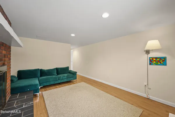 a living room with furniture and a lamp