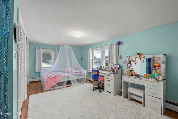 a bed room with a bed and a window