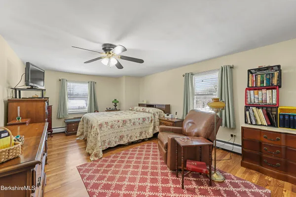 a bed room with furniture and a window