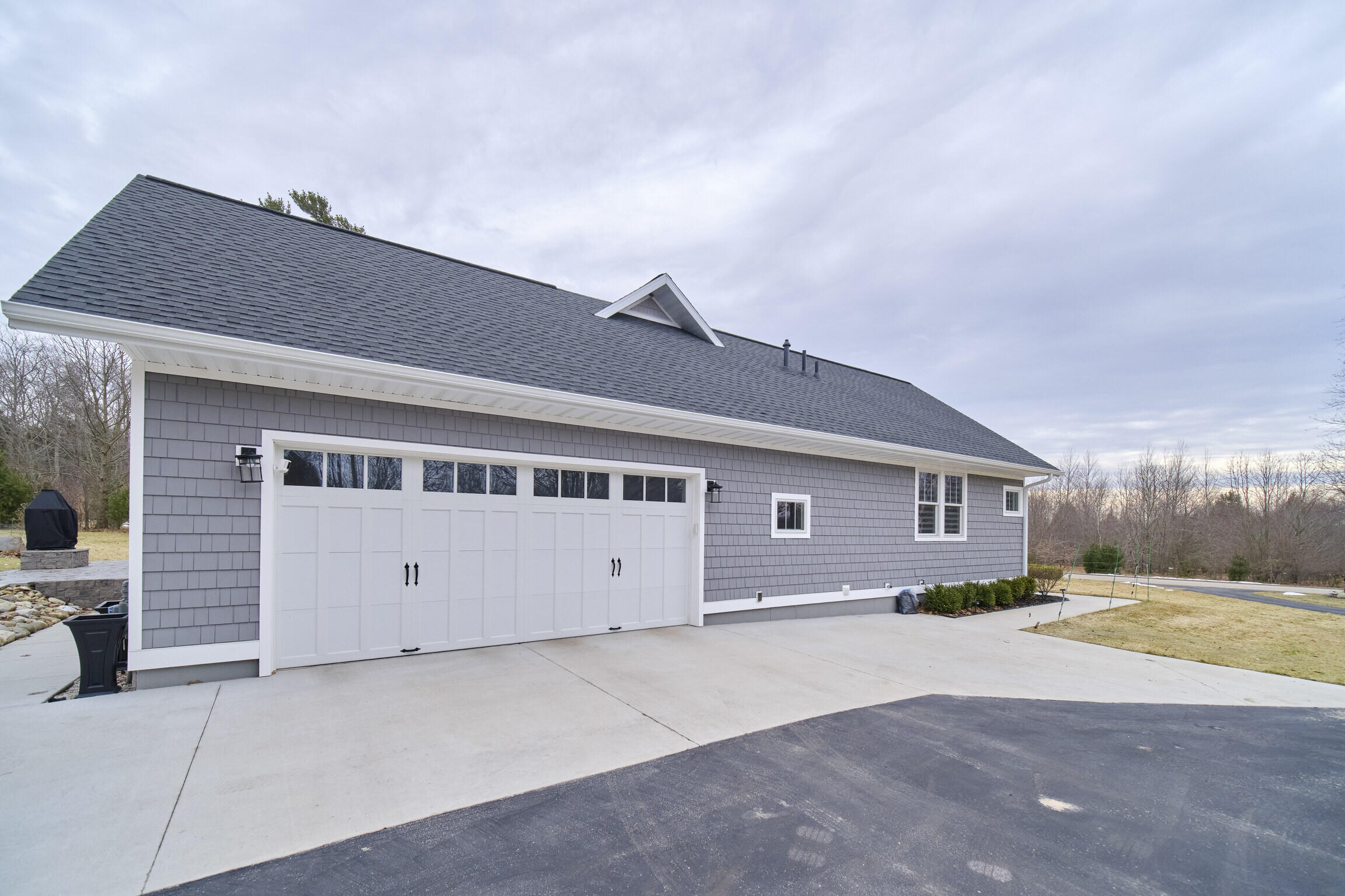 10201 Opal Ridge Drive Onekama, MI 49675 - Photo 6 of 88 2 car garage with extra storage room