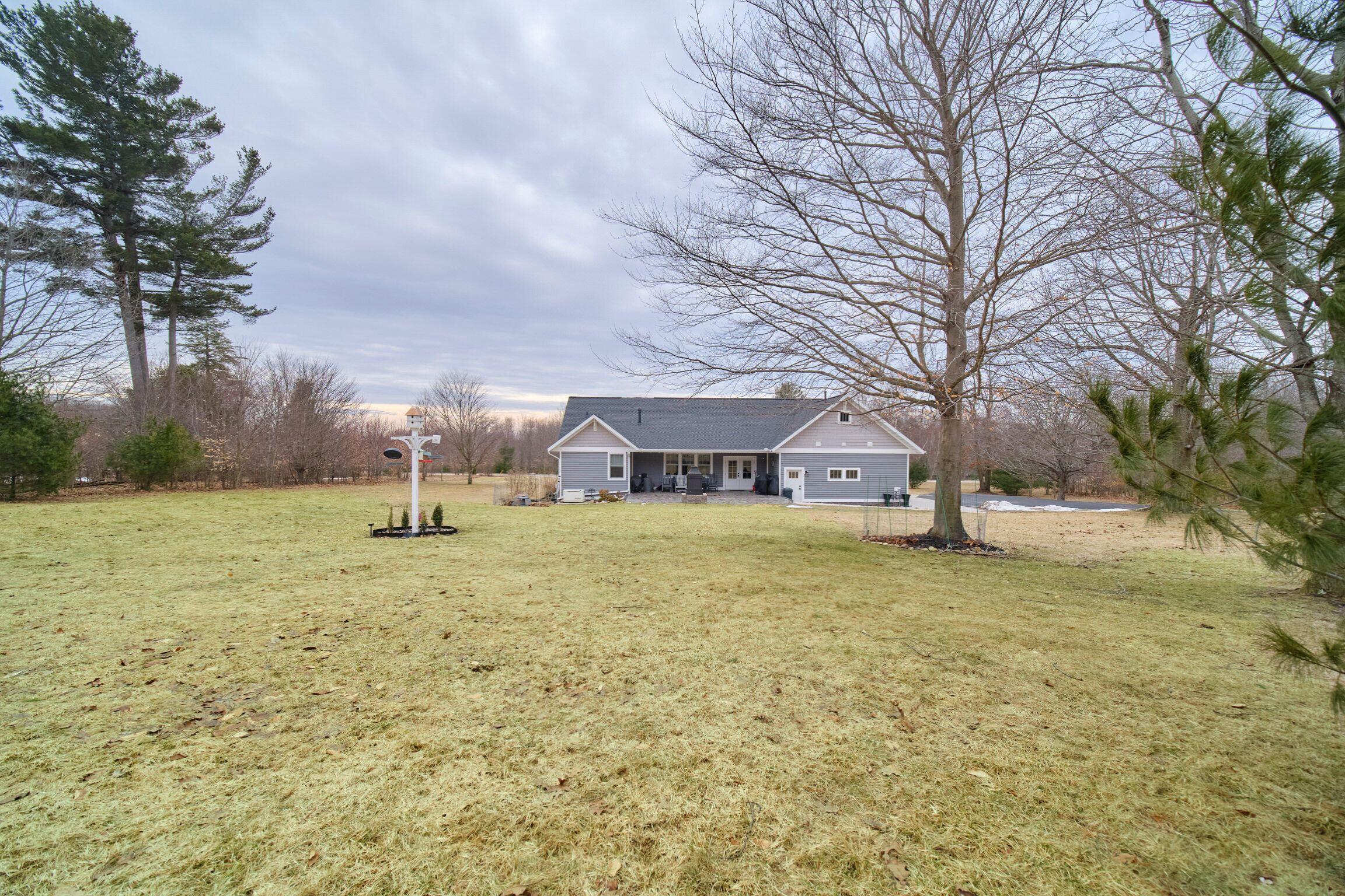 10201 Opal Ridge Drive Onekama, MI 49675 - Photo 61 of 88 Back view of home