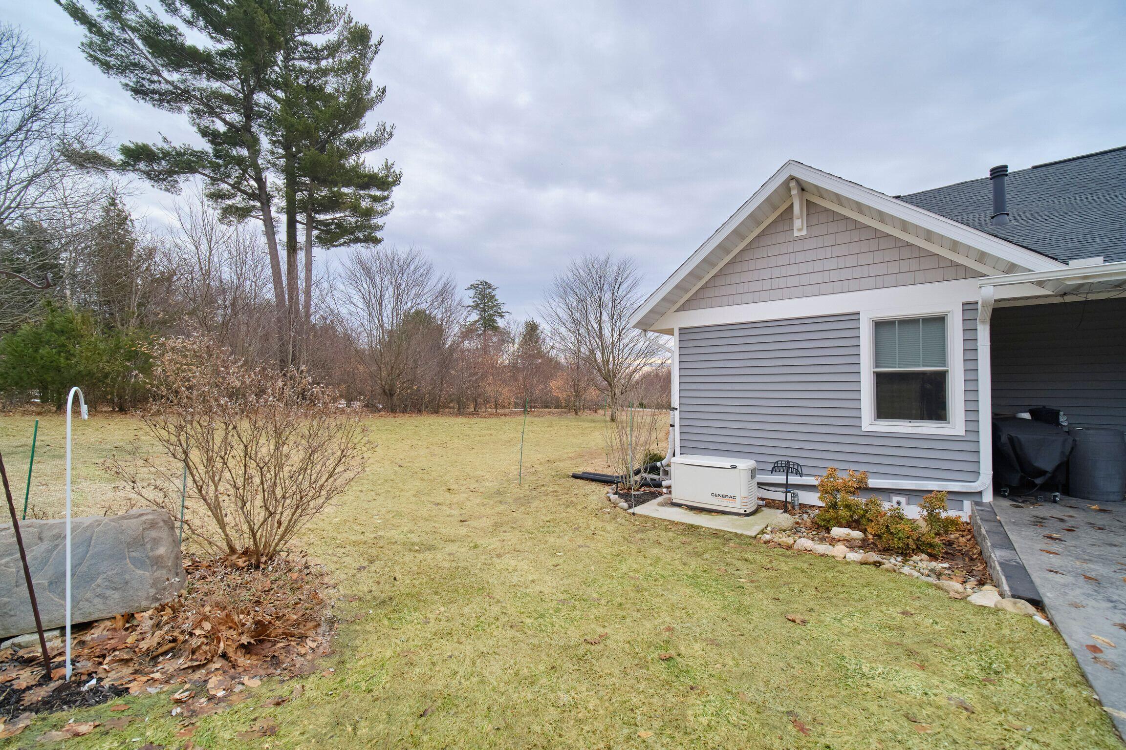 10201 Opal Ridge Drive Onekama, MI 49675 - Photo 68 of 88 Generac whole house generator