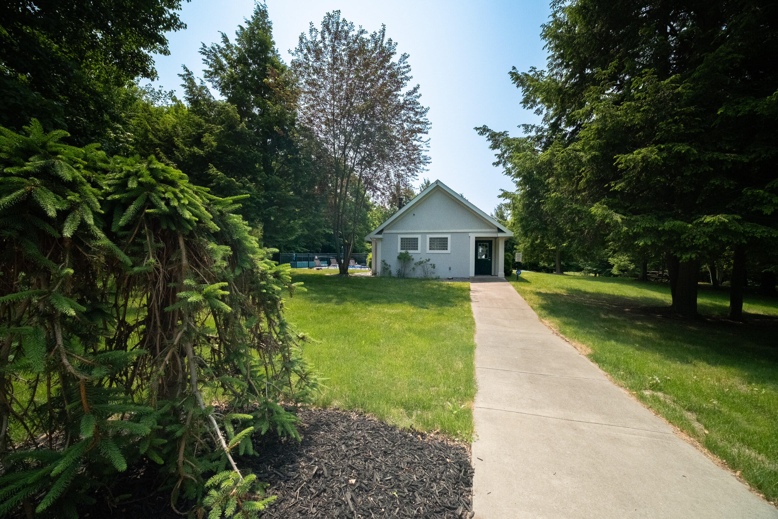 10201 Opal Ridge Drive Onekama, MI 49675 - Photo 74 of 88 Walk-up to Pool House