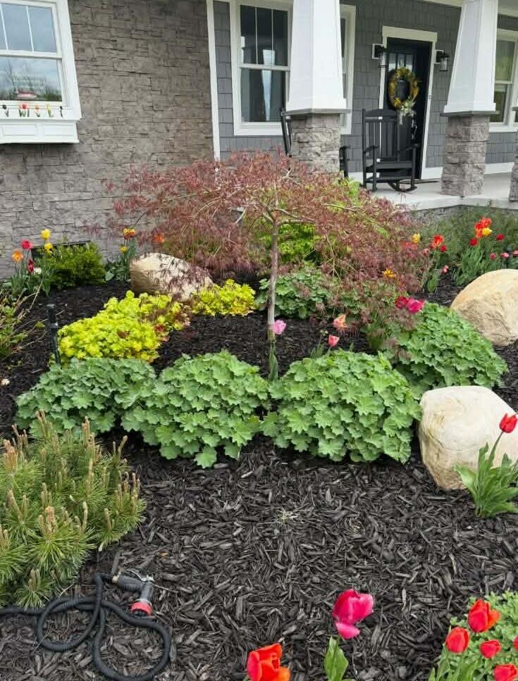 10201 Opal Ridge Drive Onekama, MI 49675 - Photo 9 of 88 Summer gardens are in