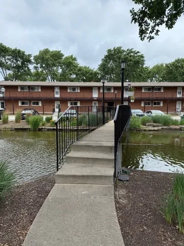 a view of a lake with a house in the background
