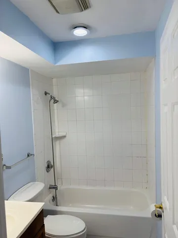 a bathroom with a sink a toilet and a bathtub