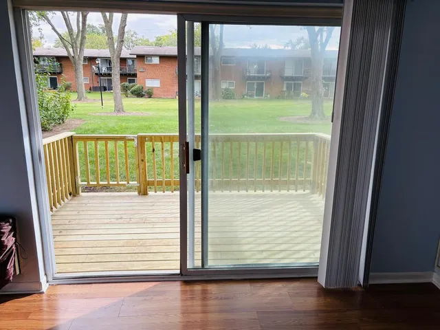 a view of a glass door with a floor to ceiling window