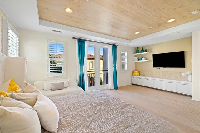 a spacious bedroom with a bed and a couch