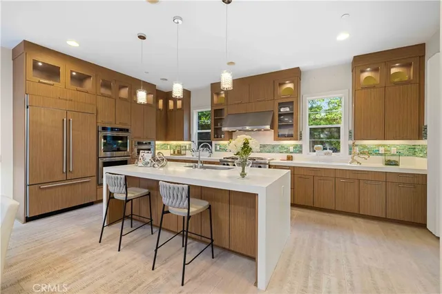 a kitchen with sink cabinets and wooden floor