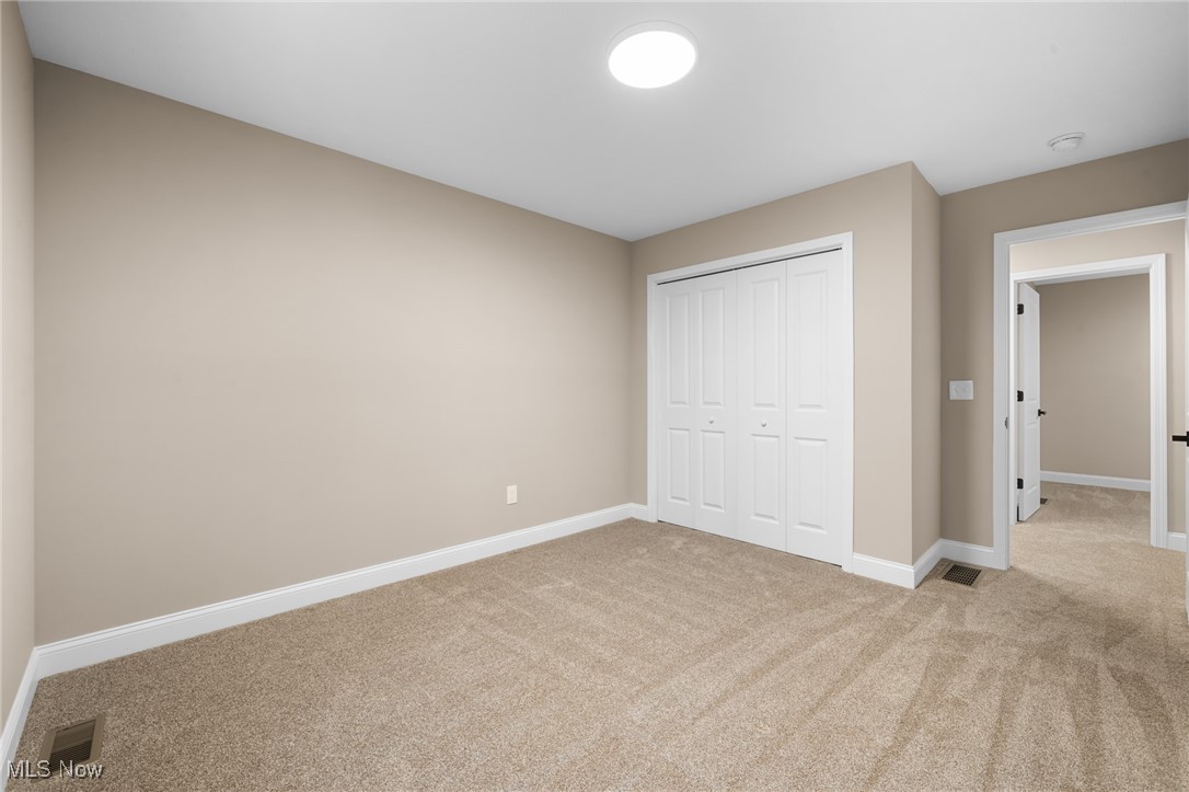 39600 Aurora Road Solon, OH 44139 - Photo 35 of 49 Unfurnished bedroom featuring light colored carpet and a closet