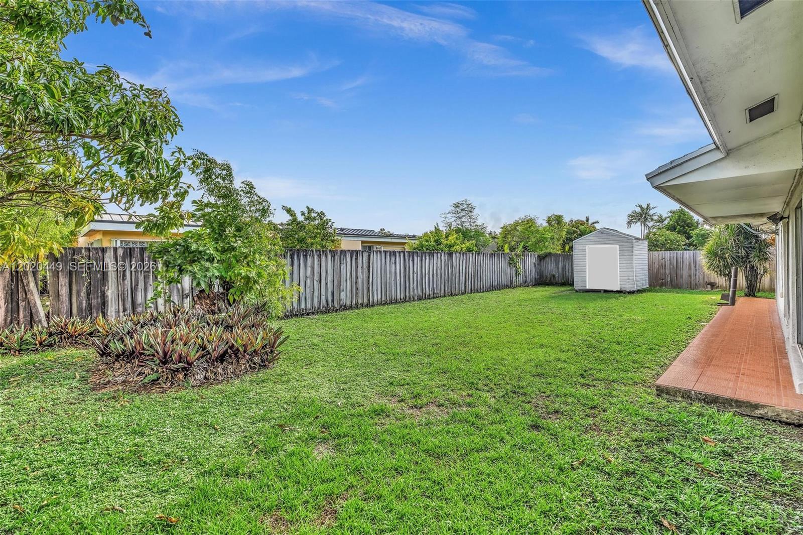 11061 Southwest 163rd Street Miami, FL 33157 - Photo 25 of 42 a view of a house with a yard