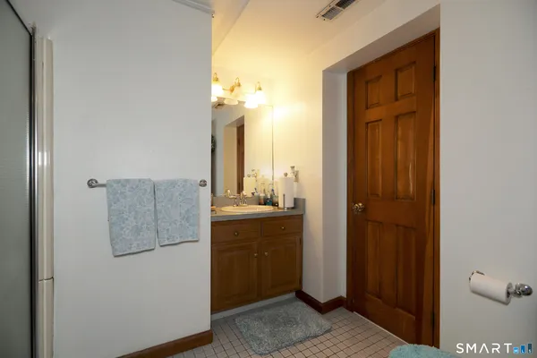 a bathroom with a sink and mirror