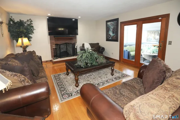 a living room with furniture and a fireplace