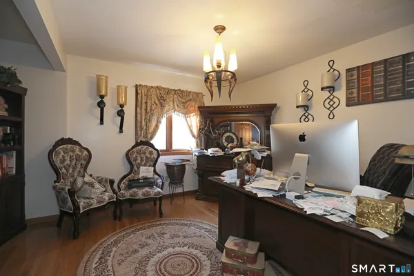 a room with lots of chairs and mirrors