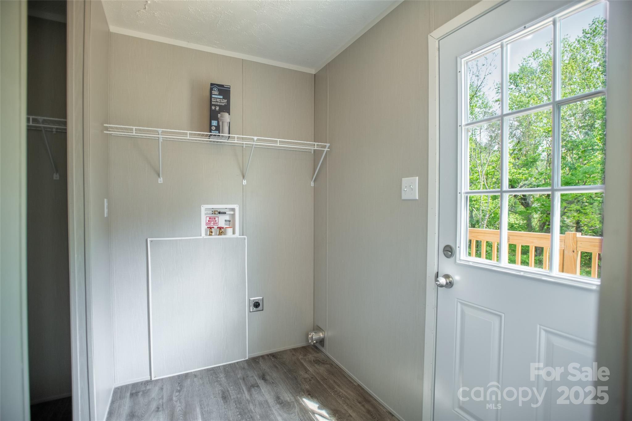 1451 Newfound Road Leicester, NC 28748 - Photo 13 of 39 a view of storage and utility room with washer and dryer