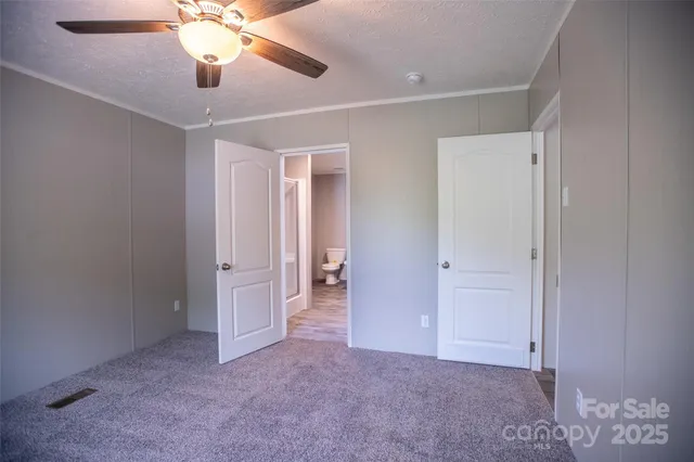 a view of a big room with closet and wooden floor