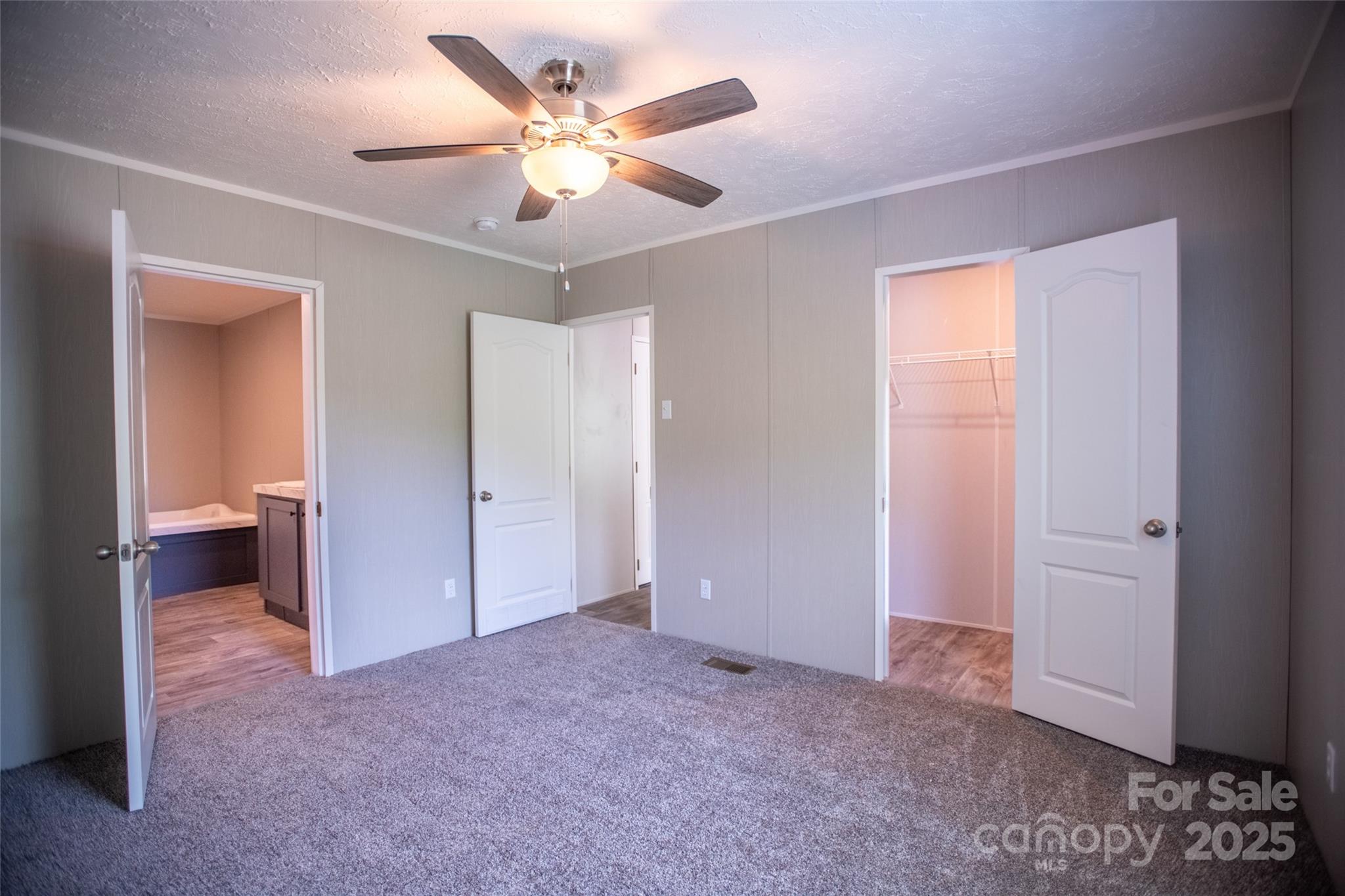 1451 Newfound Road Leicester, NC 28748 - Photo 28 of 39 a view of a big room with closet and wooden floor