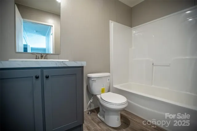 a bathroom with a toilet a sink and a bathtub