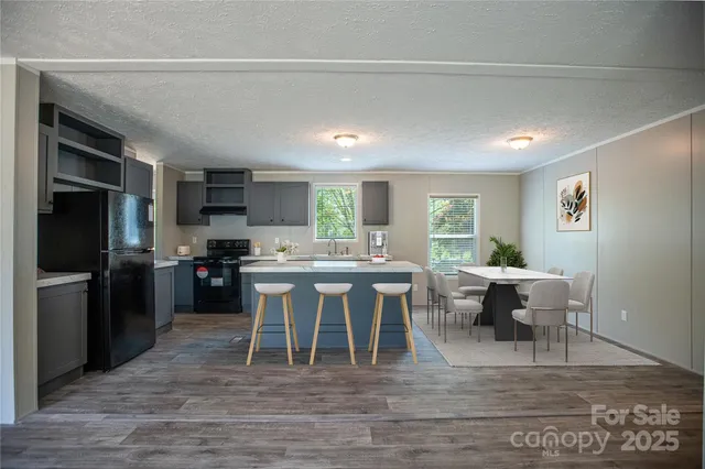 a kitchen with a table and chairs in it