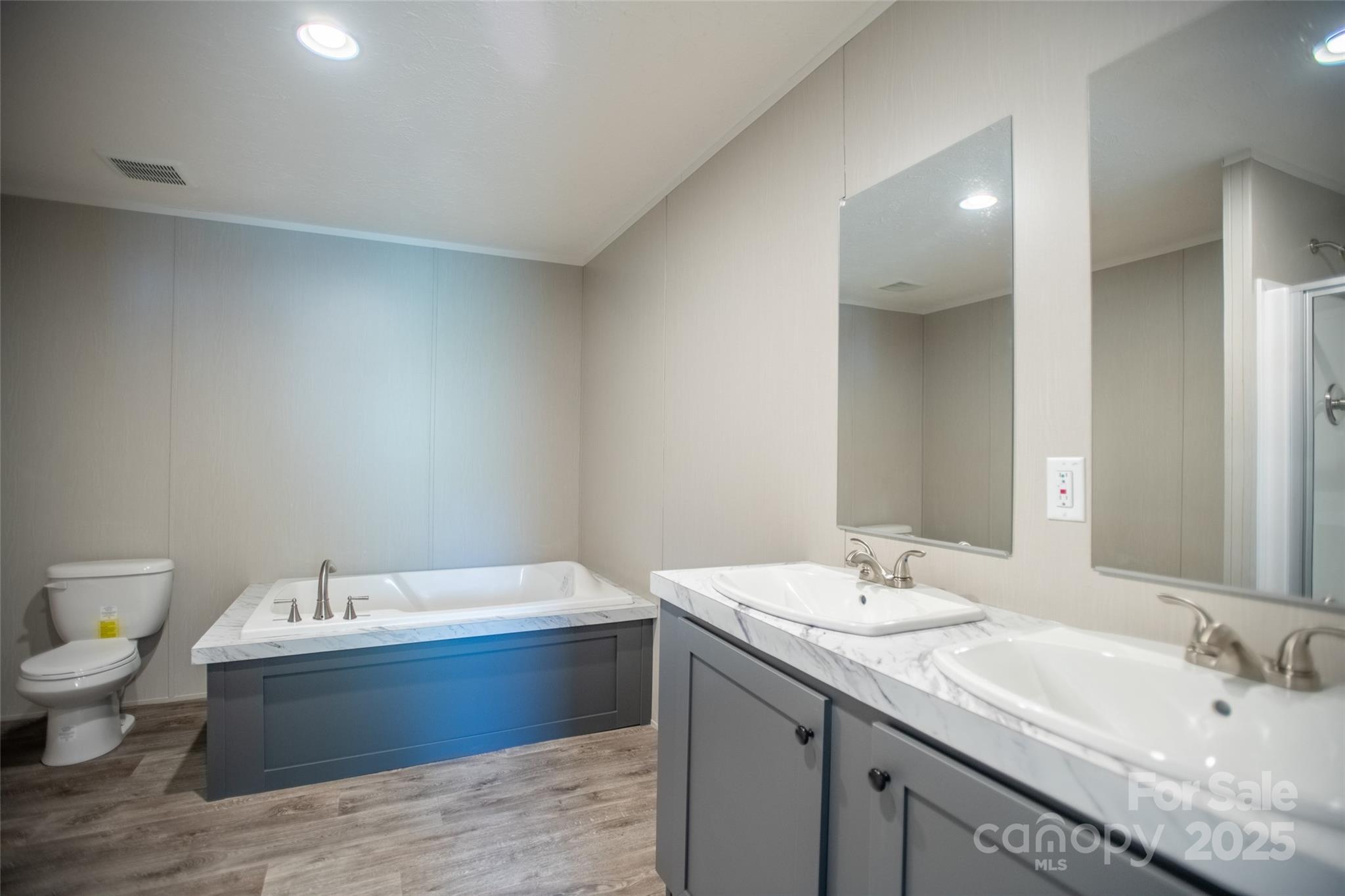 1451 Newfound Road Leicester, NC 28748 - Photo 36 of 39 a bathroom with a granite countertop sink and a mirror