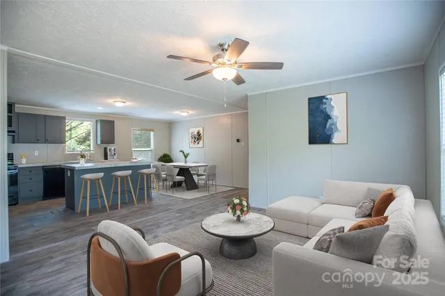 a living room with furniture and a dining table