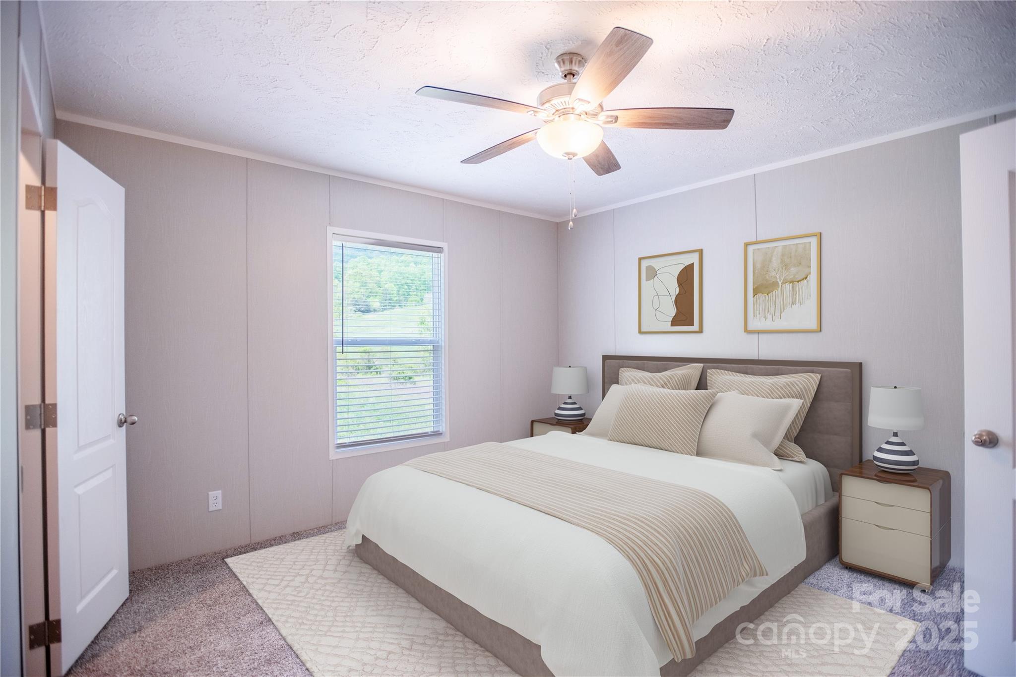 1451 Newfound Road Leicester, NC 28748 - Photo 6 of 39 a bedroom with a large bed and a chandelier