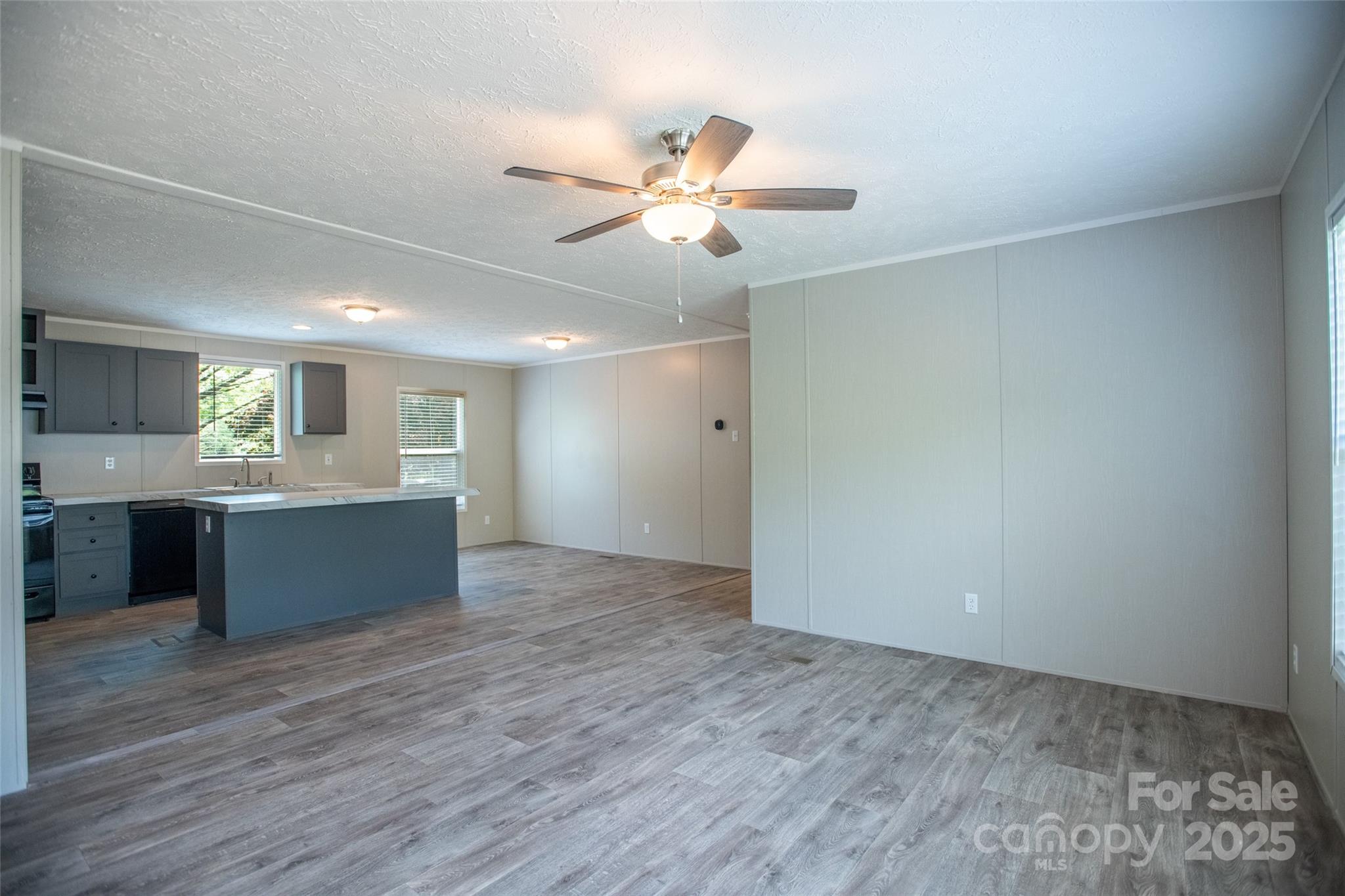 1451 Newfound Road Leicester, NC 28748 - Photo 7 of 39 a view of an empty room with window and wooden floor