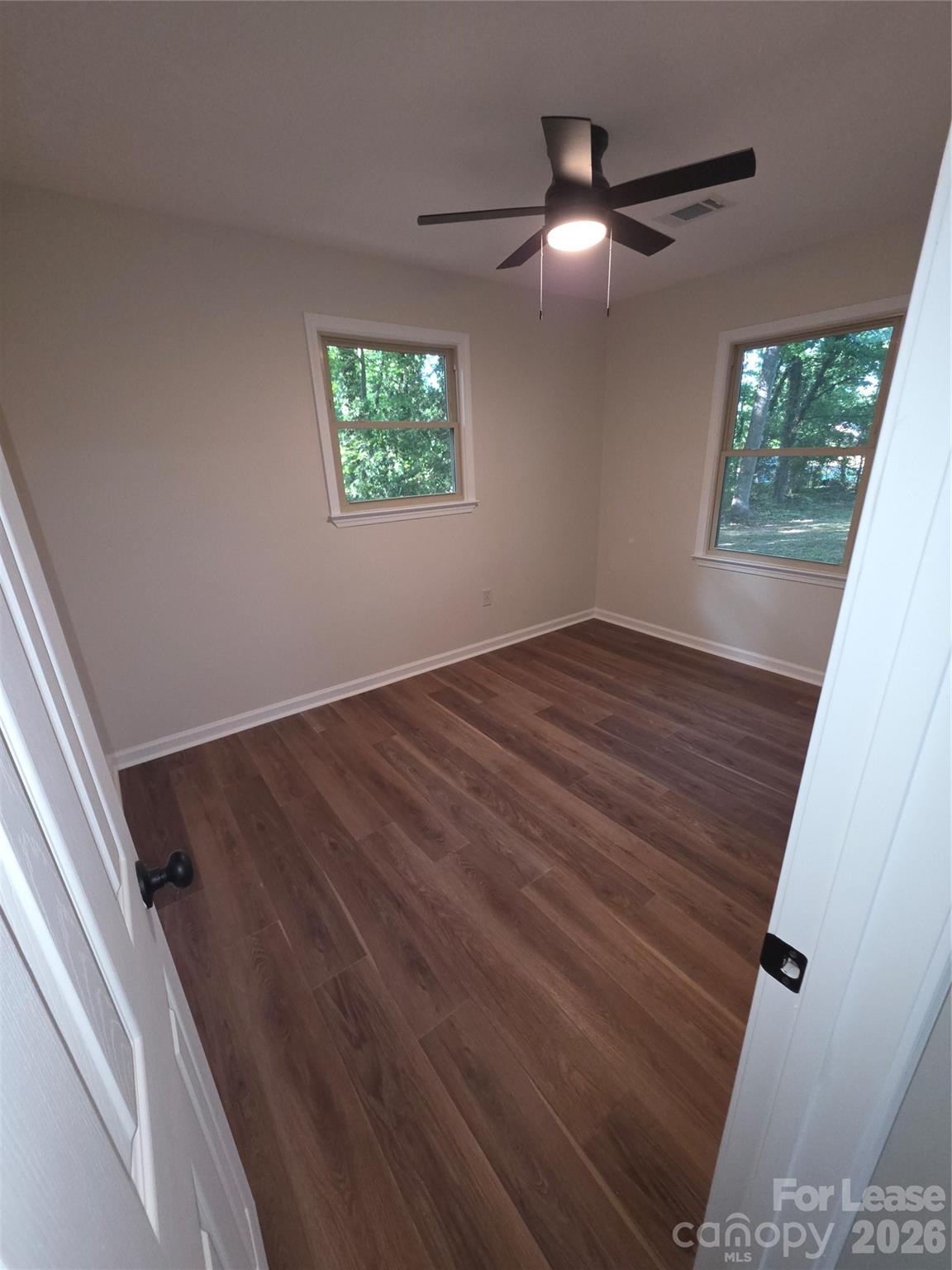 5710 Unionville Road Monroe, NC 28110 - Photo 12 of 18 wooden floor in an empty room with a window