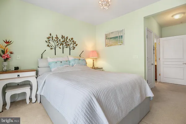 a bedroom with a bed and a table