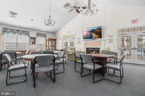 a kitchen with stainless steel appliances granite countertop a sink and a stove