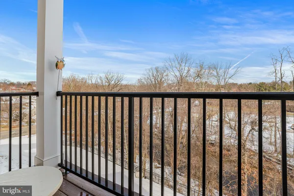 a view of a balcony with wooden floor